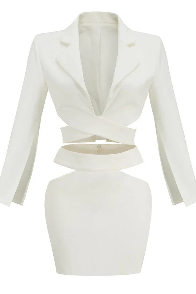 White two-piece set with cut-out details, featuring a wrap top and high-waisted skirt.
