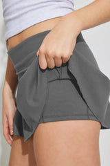 Close-up of the grey skort showing the fabric and built-in shorts