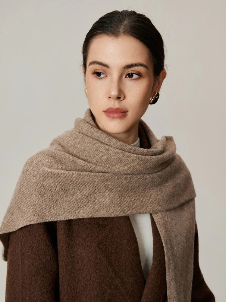 Woman wearing a beige scarf draped around her neck, front view