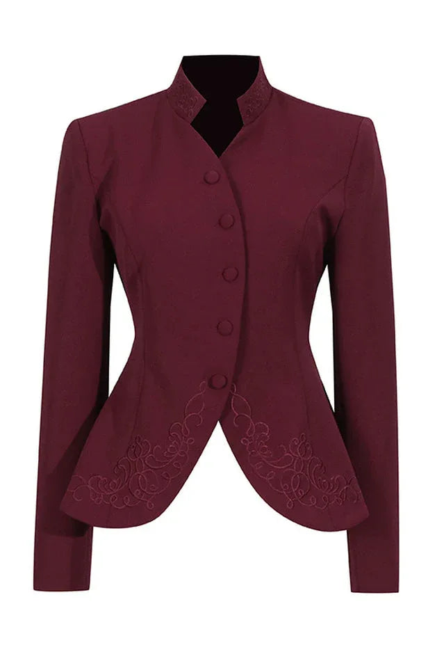 Close-up of a burgundy jacket with a mandarin collar, button closure, and embroidered hem.