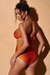 Rear view of a woman wearing an orange bikini set