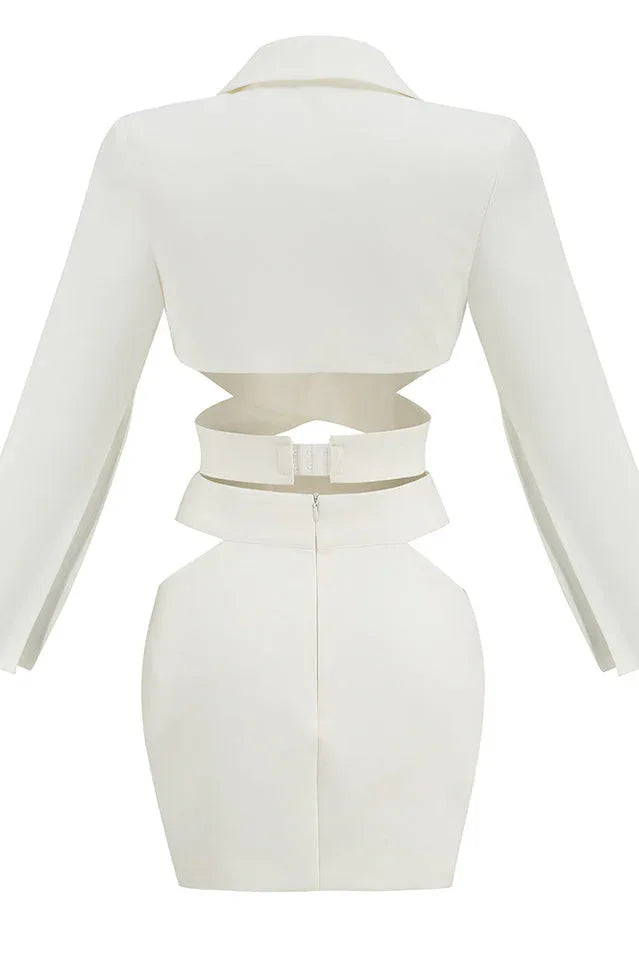 Back view of a white two-piece set with cut-out details and a zipper closure.