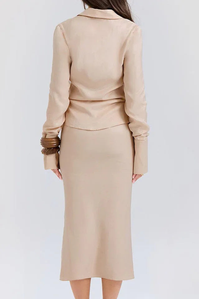 Woman modeling a beige linen blend outfit with a V-neck tie-front top and midi skirt outdoors.