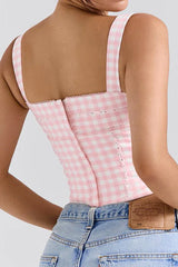 Back view of a pink and white gingham corset top with a zipper closure.