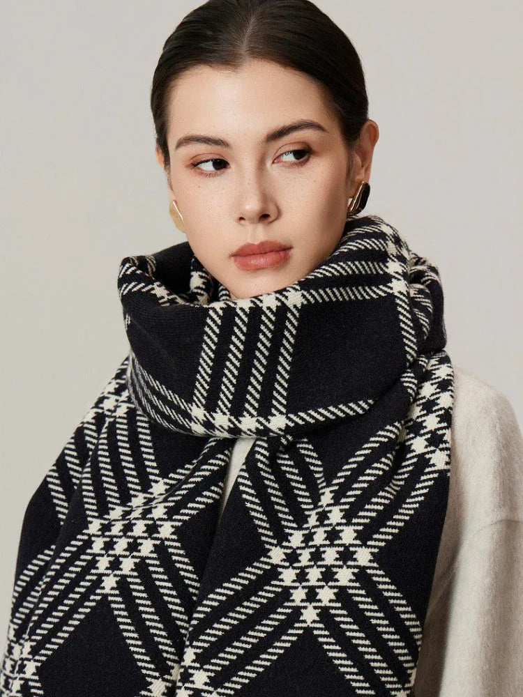 Close-up of a woman wearing a black and white tartan scarf