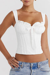 Front view of a white ruched corset top with a bow accent.