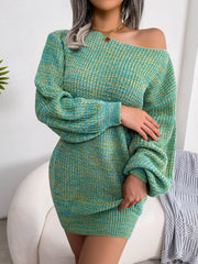 Woman wearing a green and yellow marled knit off-the-shoulder mini dress with long balloon sleeves, arms crossed.