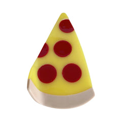 A close-up shot of a pizza slice-shaped hair clip with red pepperoni.