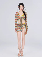 Full-length view of a woman in a crocheted knit outfit with a bikini