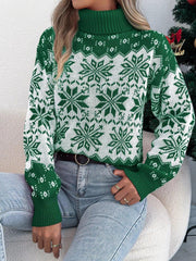 Woman sitting on a couch wearing a green and white snowflake print turtleneck sweater