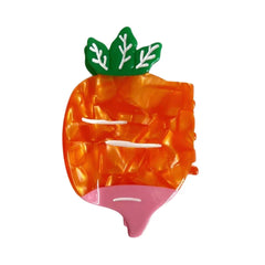 Orange carrot-shaped hair clip with green leaves and pink bottom.