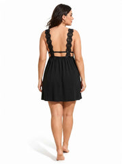 Woman wearing a black lace-trimmed babydoll nightgown from the back
