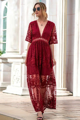 woman in a red lace maxi dress