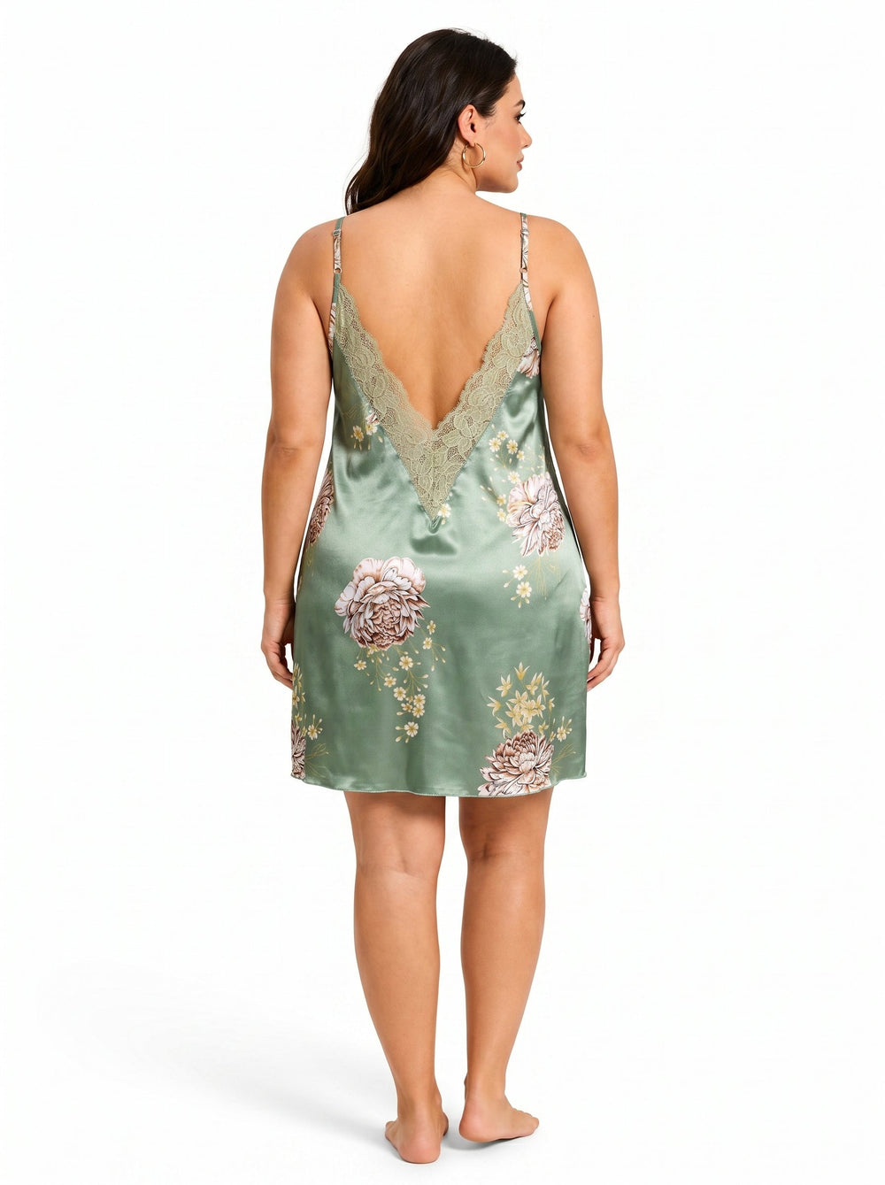Back view of a plus-size model in a green satin floral print chemise