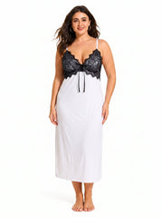Woman wearing a white satin slip dress with a black lace bust