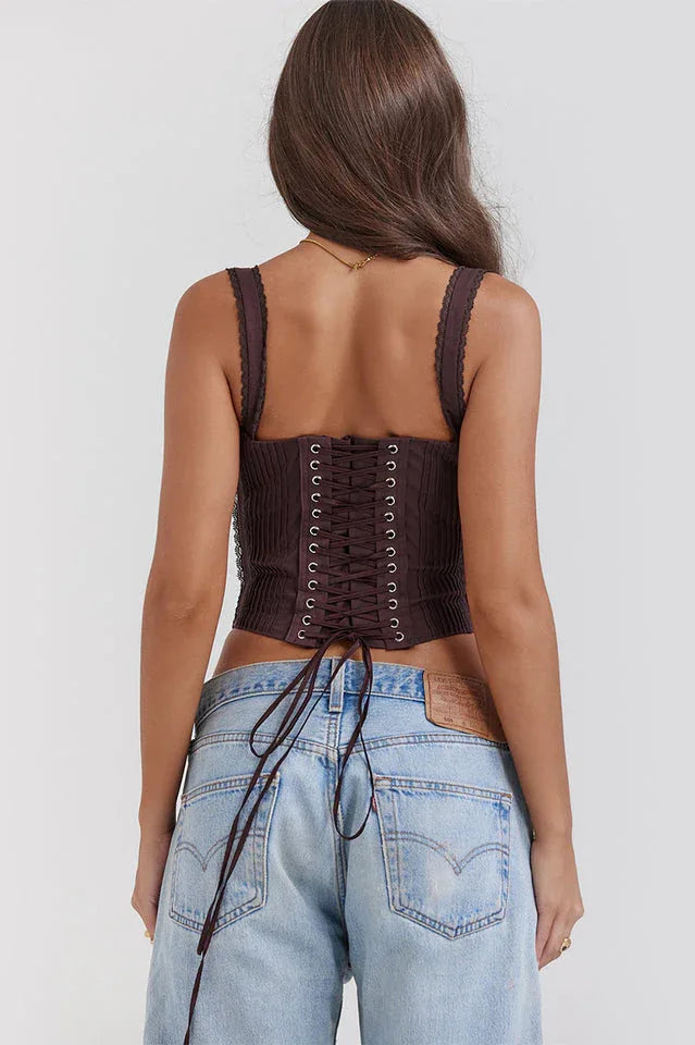 Rear view of a brown satin corset top with lace-up closure