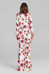 Rear view of a woman in a white floral print suit
