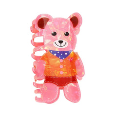 Pink iridescent bear-shaped hair claw clip with a detailed outfit