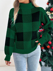Woman in a green and black buffalo plaid turtleneck sweater touching her neck