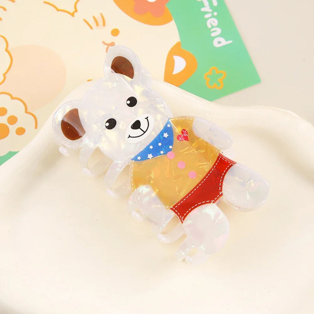 White iridescent bear-shaped hair claw clip with a detailed outfit