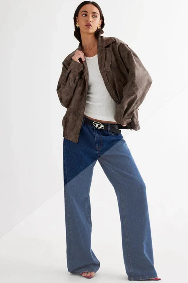 Model wearing a brown faux leather jacket, white tank top, and blue wide-leg jeans