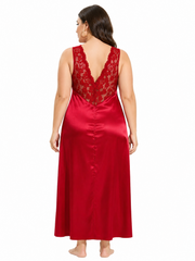 Back view of a woman in a red satin nightgown with a lace V-back