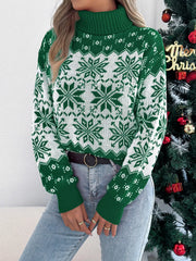 Close-up of a woman wearing a green and white snowflake print turtleneck sweater