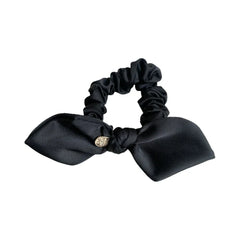 Black satin scrunchie with a bow and gold-tone charm