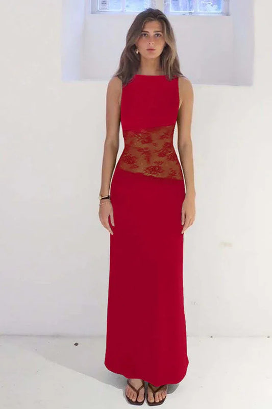 Woman wearing a floor-length red sleeveless dress with sheer lace waist detailing.