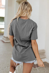 Back view of a woman in a plain grey t-shirt.