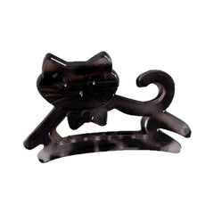 A black cat-shaped hair claw clip with a bow tie detail.
