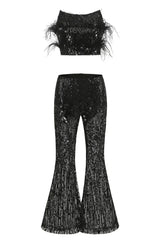 Black sequined cropped bandeau top with feather trim and matching flared sequined pants, laid flat.