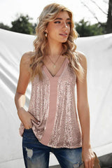 Woman wearing a pink sequined camisole with a v-neck, showing the side profile and back.