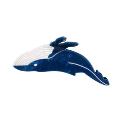 A single blue and white whale-shaped hair claw clip against a white background.