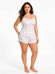 Full body shot of woman in white floral print pajama set