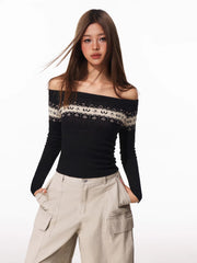 Front view of a woman in a black off-the-shoulder sweater with Fair Isle detail and beige cargo pants.