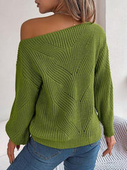 Back view of a woman wearing a green off-the-shoulder knit sweater with a textured pattern and lantern sleeves.
