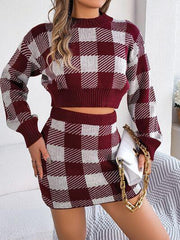 Woman wearing a burgundy and white gingham check knit cropped sweater and mini skirt set, holding a white handbag