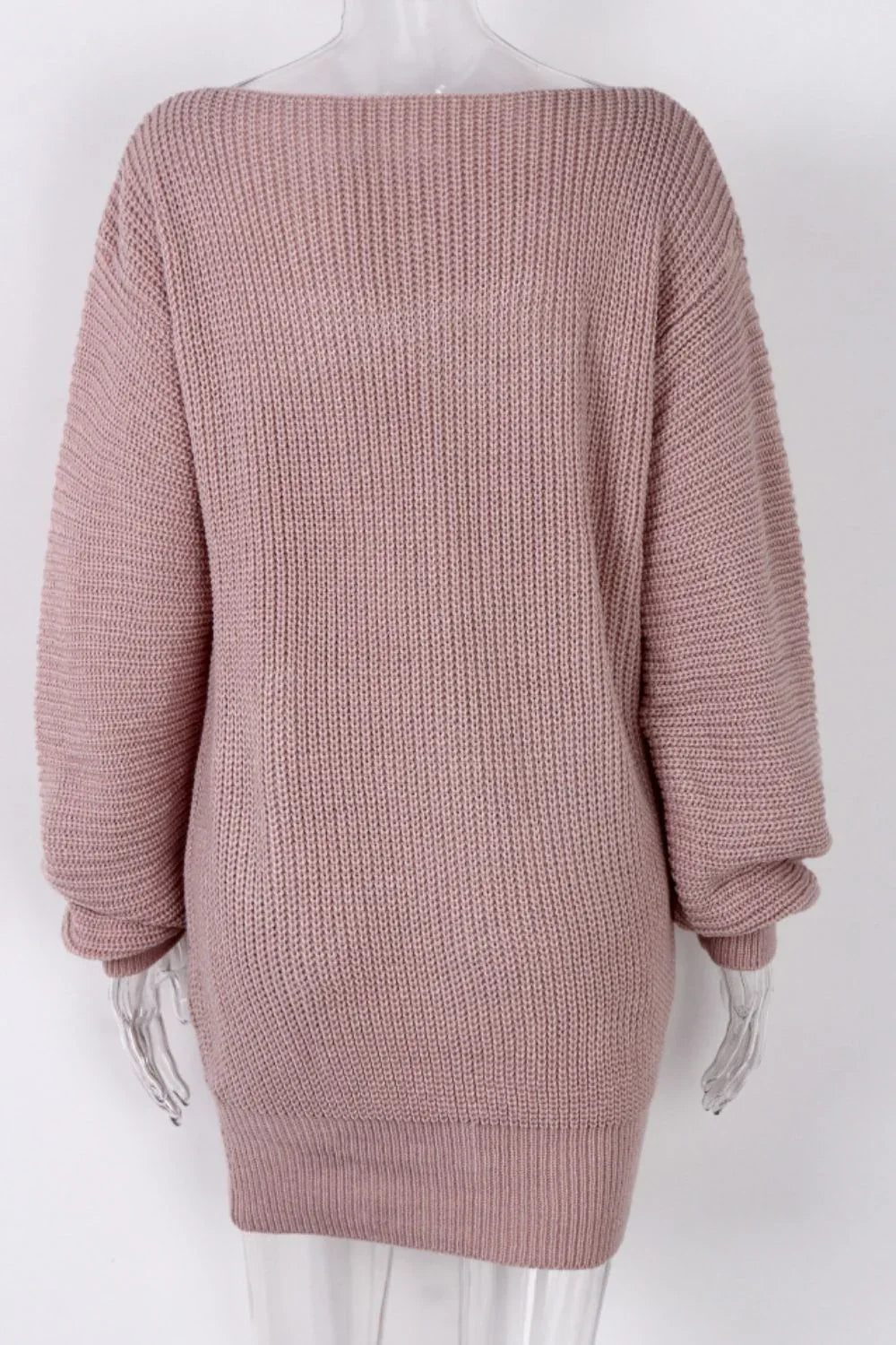 Back view of a pink off-the-shoulder ribbed knit tunic sweater on a mannequin.