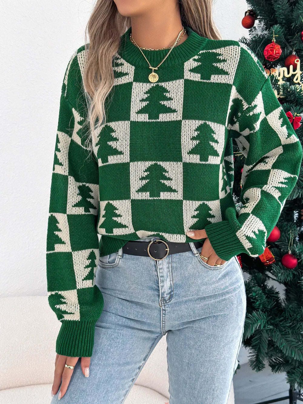 Close-up of a woman wearing a green and white checkered Christmas tree sweater