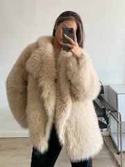 woman wearing a beige faux fur coat