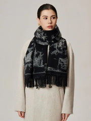 Woman wearing a black and white patterned scarf draped over a cream coat