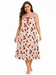 Full-body front view of a plus size woman wearing a cream and red floral print nightgown