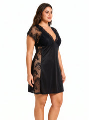 Plus-size model in a black lace-trimmed chemise, side three-quarter view