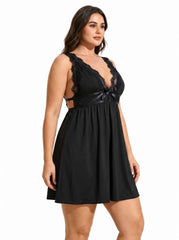 Woman wearing a black lace-trimmed babydoll nightgown from the side