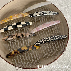 Assortment of decorative hair combs in various patterns