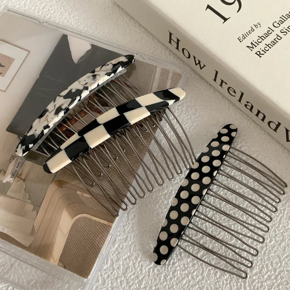 Collection of patterned hair combs on a surface