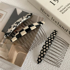 Collection of patterned hair combs on a surface