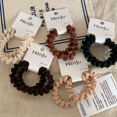 Scattered spiral hair ties in different colors