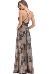 Back view of a black sequined evening gown with criss-cross straps.